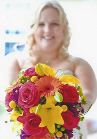 happy bride with floral boquet from Waukesha Floral
